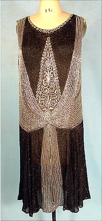 http://www.antiquedress.com/images/2552/flapperblckbestsilvdresd.jpg